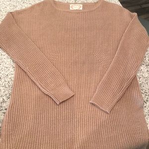 Cute and cozy tan sweater with side-slit detail!